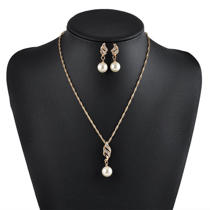 Pearl necklace and matching pearl drop earrings set with gold-tone chain and crystal-accent pendant
