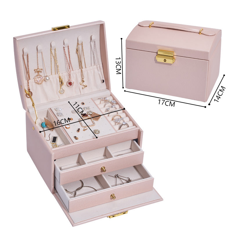 Three-layer drawer jewelry storage box by edenista; pink with gold hardware and multiple compartments
