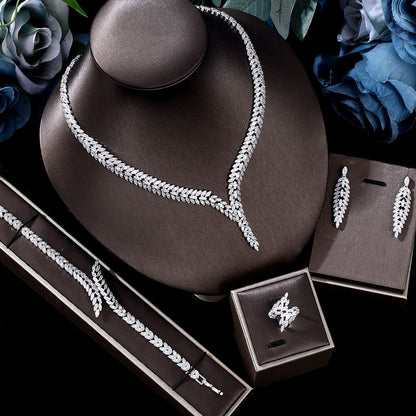 4-piece CJ 3A zircon crystal jewelry set: necklace, bracelet, earrings, and ring in silver-tone
