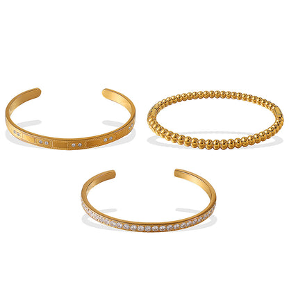 Gold-tone bracelet set: open-end crystal-accent cuff, beaded ball bracelet, and pavé diamond cuff (3 pcs)