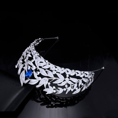 CJ Sapphire Crown Copper Micro Inlay AAA Zircon Crown Wedding Headdress with silver-tone leaf design and blue gem.