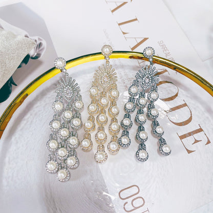 Five pairs of CJ Micro Inlay Zircon Beaded Fringe Earrings with pearl accents in silver, gold and blue tones