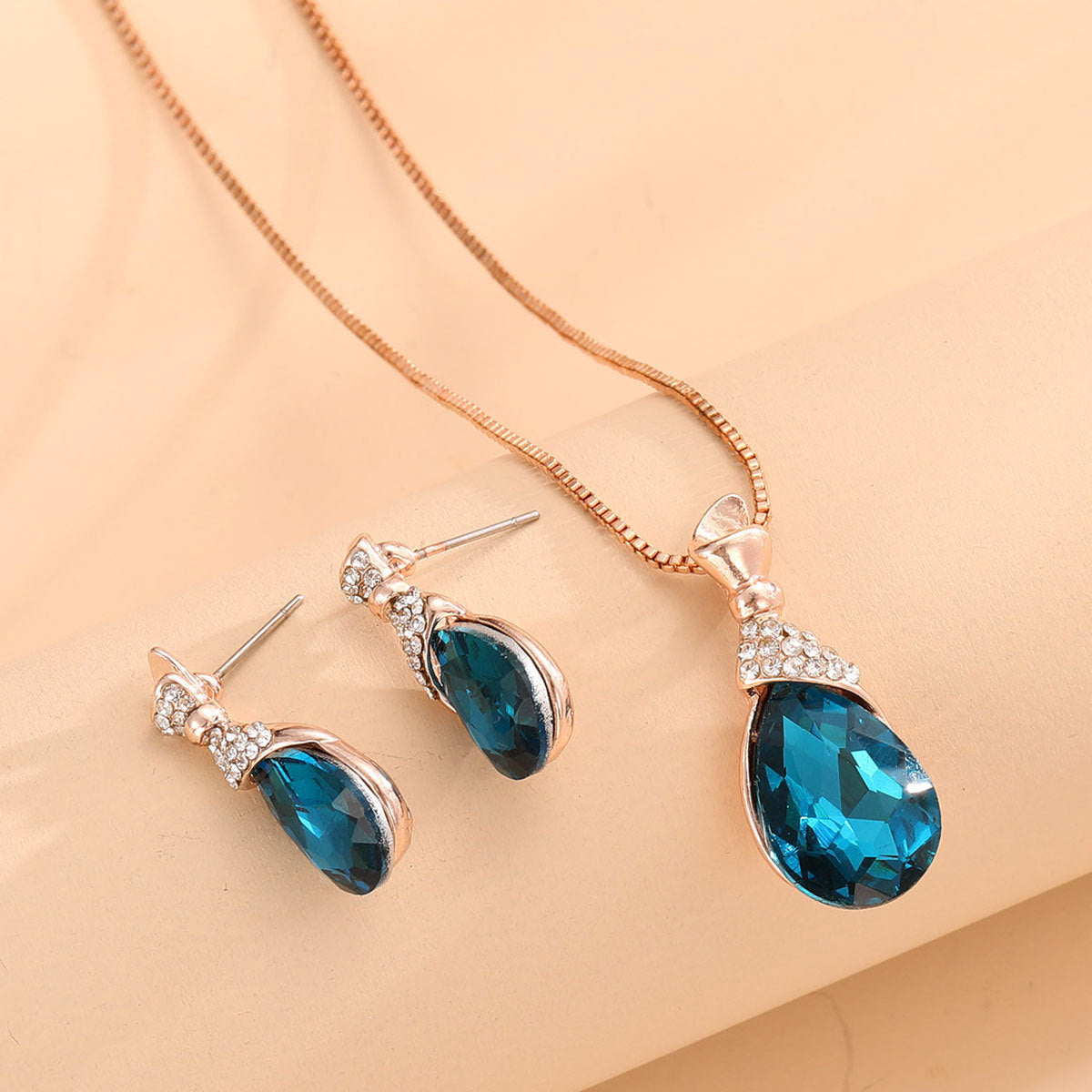 Bridal necklace and earrings set with teal peacock teardrop gems, rose gold tone, pave crystals