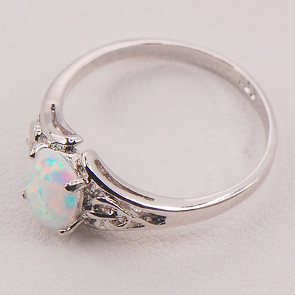 CJ opal ring, silver band with iridescent opal centerpiece
