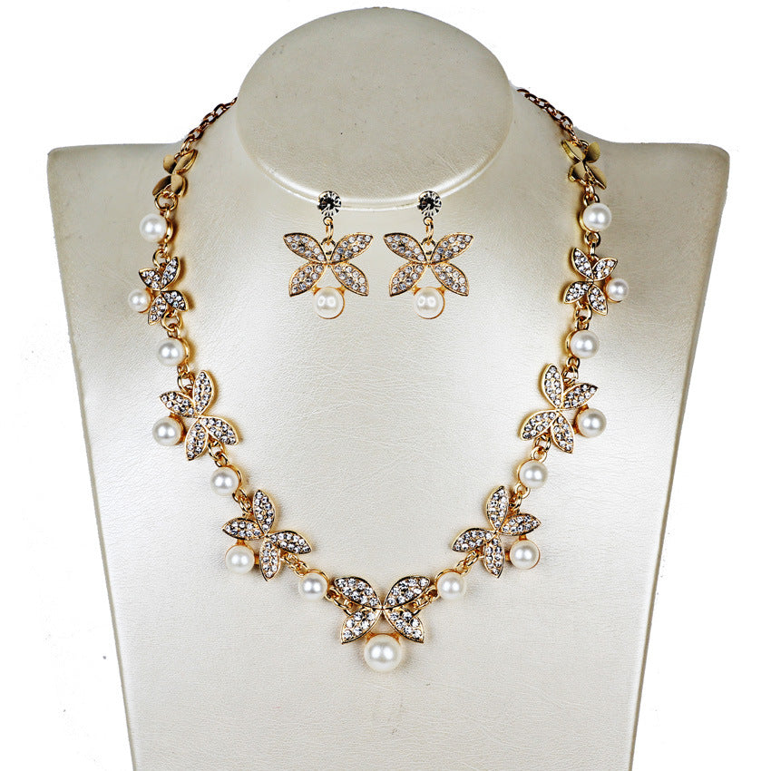 Pearl butterfly bridal jewelry set with necklace and earrings by CJ, gold-tone with crystal butterflies and pearls.