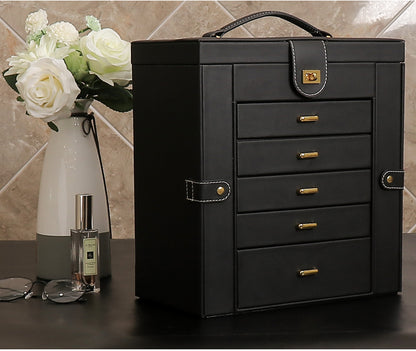 edenista black multifunctional jewelry box with gold-tone hardware and top handle.