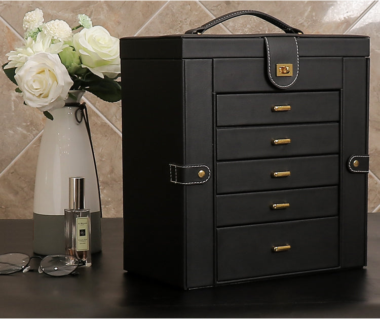 Multifunctional jewelry box by edenista; black leather with gold drawer pulls and top handle