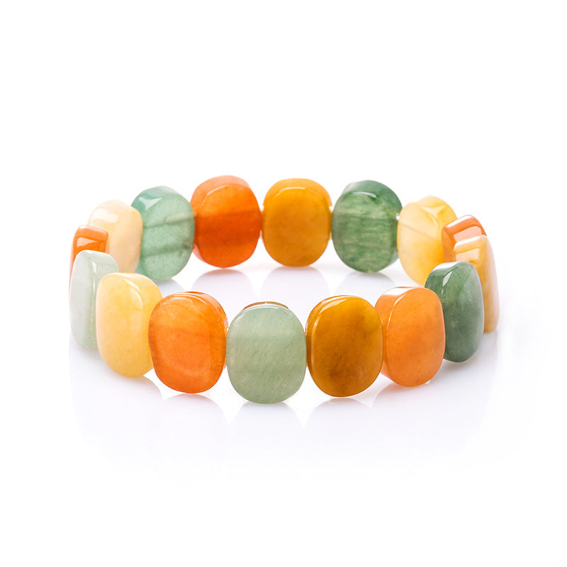 Natural crystal bracelet with multicolor orange, green, and yellow beads.