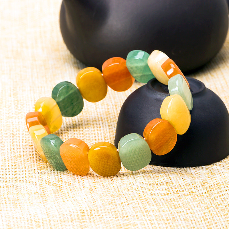 Natural crystal bracelet with round orange, yellow and green beads