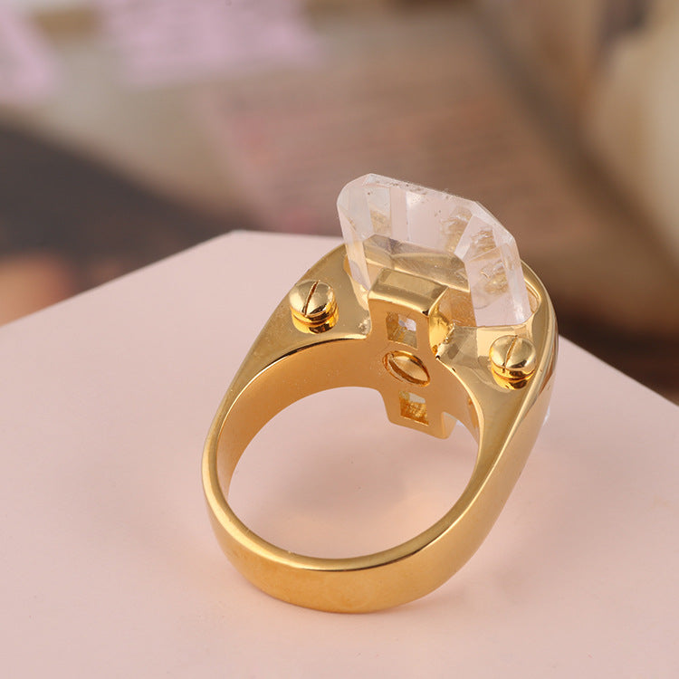 Ring with gold-tone band and large rectangular natural stone setting