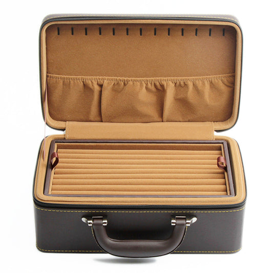 Jewelry storage box by edenista, brown leather exterior with tan interior and ring slots.