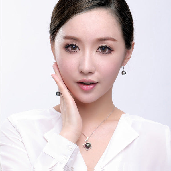 Natural Deep Sea Nanyang Pearl Ring by CJ, silver-tone setting with a dark pearl