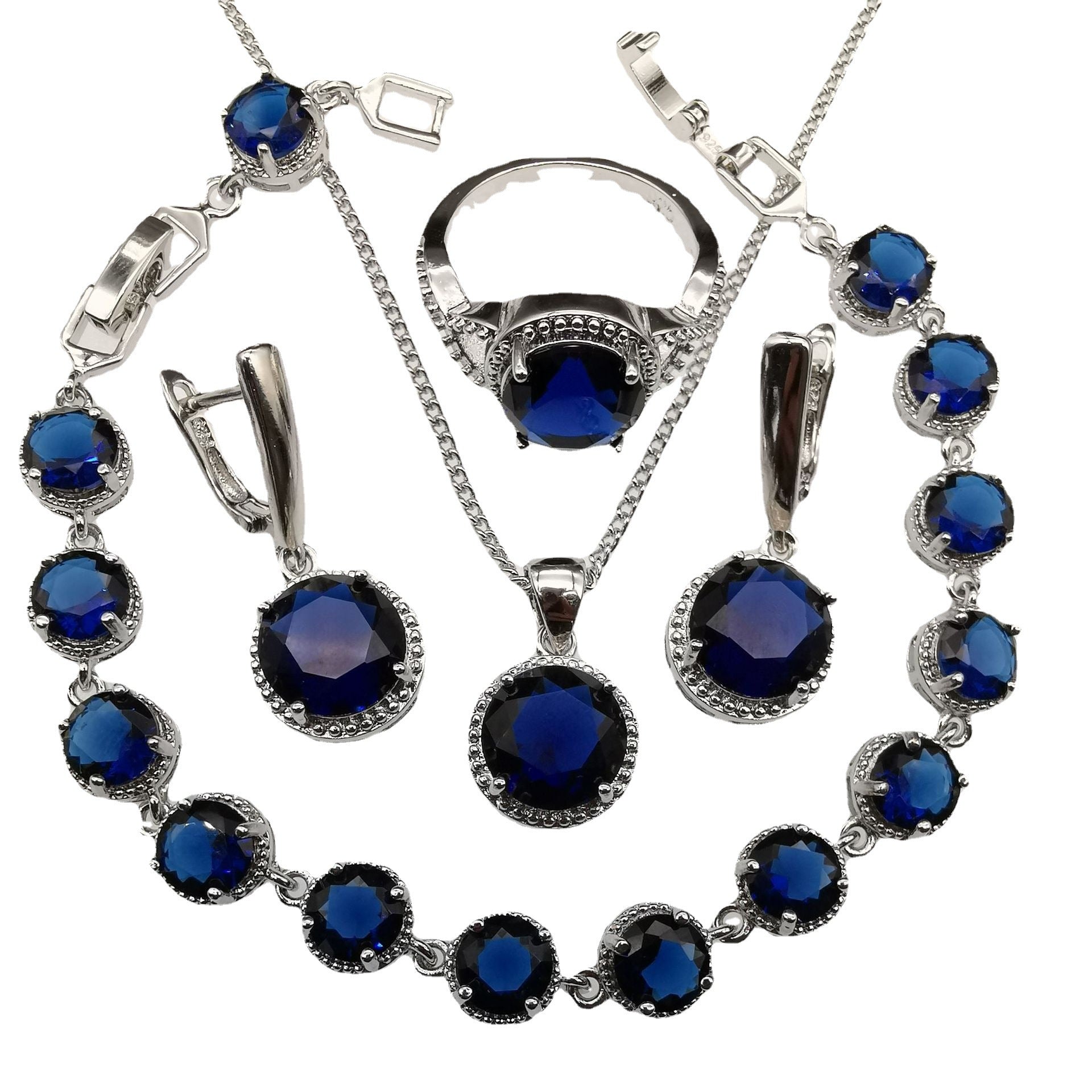 European American style 4-piece jewelry set with round blue stones in silver-tone metal.