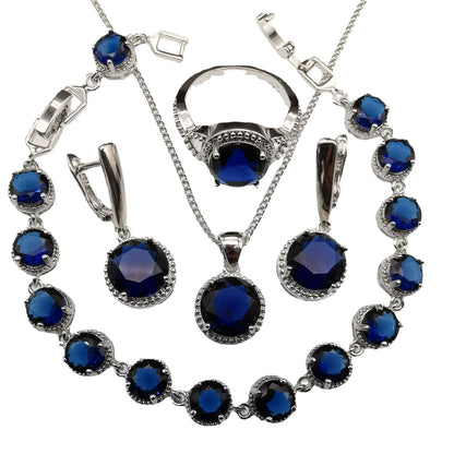 European American style 4-piece jewelry set with round blue stones in silver-tone metal.