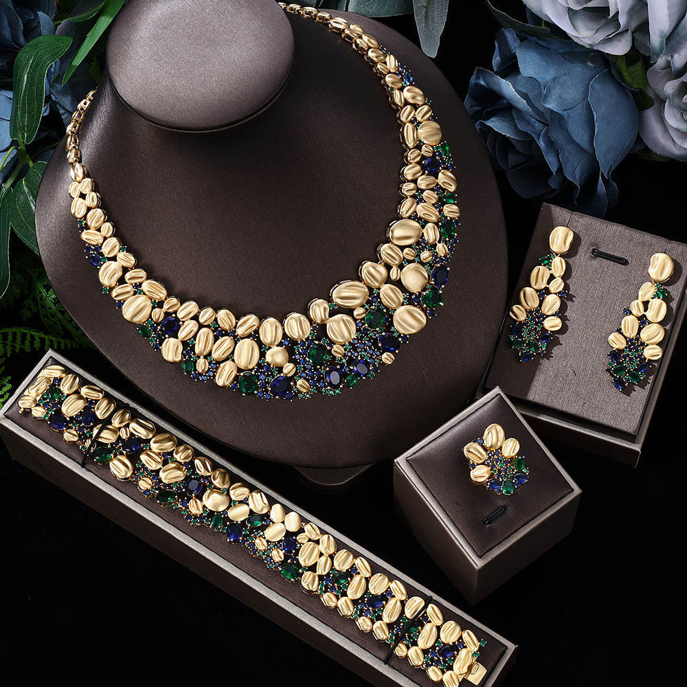 Exaggerated gold-tone necklace and earrings wedding set with blue-green stones; includes bracelet and ring (4-piece)