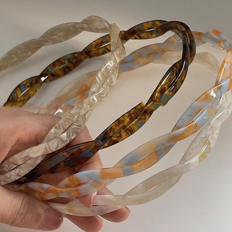 Acetic Acid Cross Minimalist Hairband set of four translucent acrylic hoops in clear and marbled tortoiseshell tones.