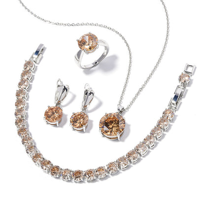 Geometric round crystal jewelry set CJ: silver-tone 4-piece necklace, bracelet, ring and earrings in champagne tones.