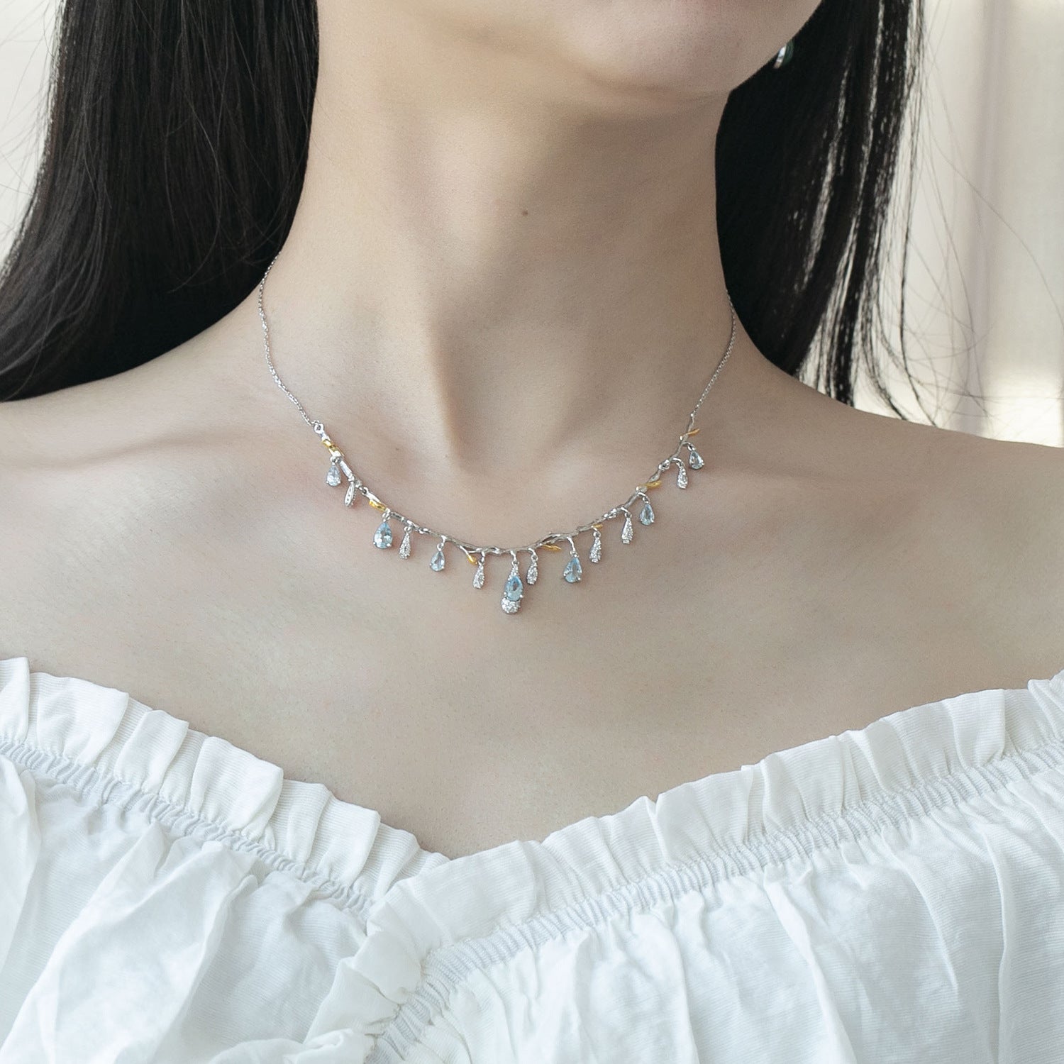 S925 silver natural topaz necklace with teardrop blue topaz drops on a delicate chain.