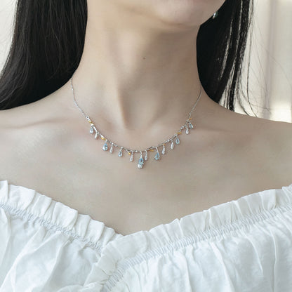 S925 silver natural topaz necklace with teardrop blue topaz drops on a delicate chain.
