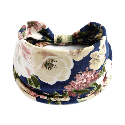 Bohemian floral yoga headband in blue with cream and pink flowers; absorbent fabric.