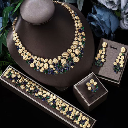 Exaggerated necklace, bracelet, and earrings wedding set in gold-tone with blue and green stones, CJ brand