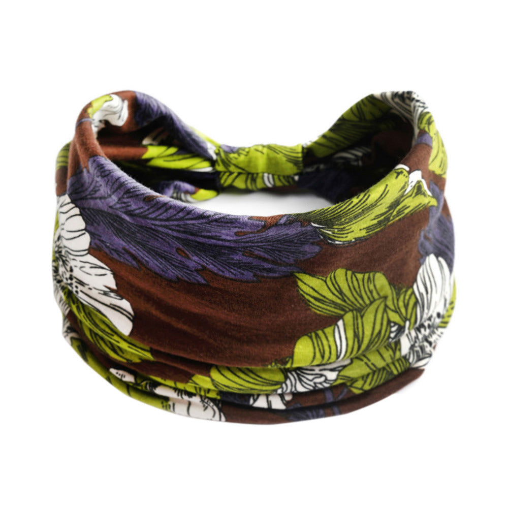 Bohemian Cashew Yoga Headband with brown, lime green and purple floral print; elastic
