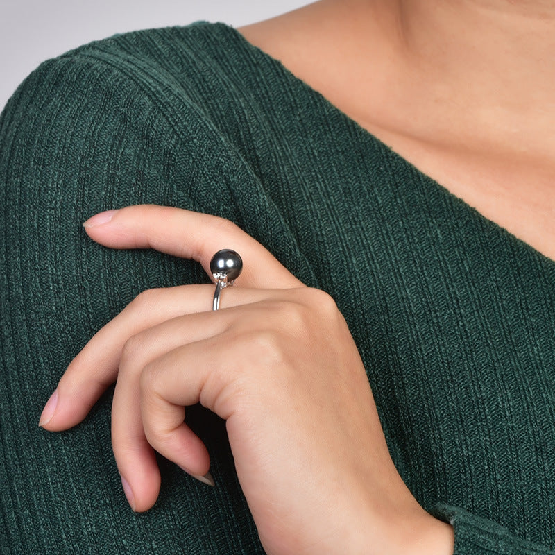 Natural Deep Sea Nanyang Pearl Ring with a black pearl on a silver band