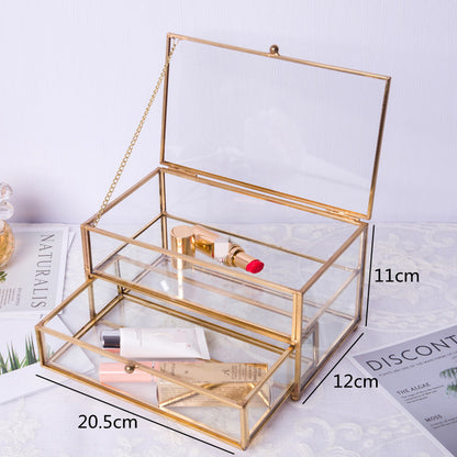 Jewelry storage box by edenista with glass panes and gold-tone frame.