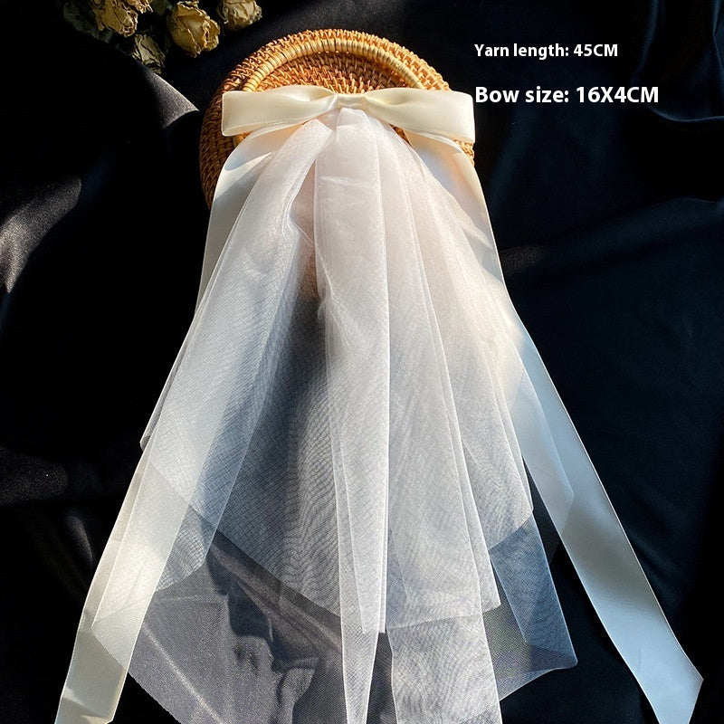 Bow Veil Super Fairy Wedding Trip Shoot white tulle veil with bow on wicker basket