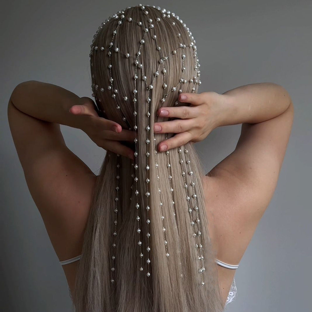 Pearl hairband accessory by CJ with cascading white pearl strands for formal dresses.