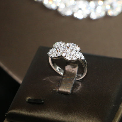 Bridal zircon ring by cj, silver-tone band with a cluster of clear stones.