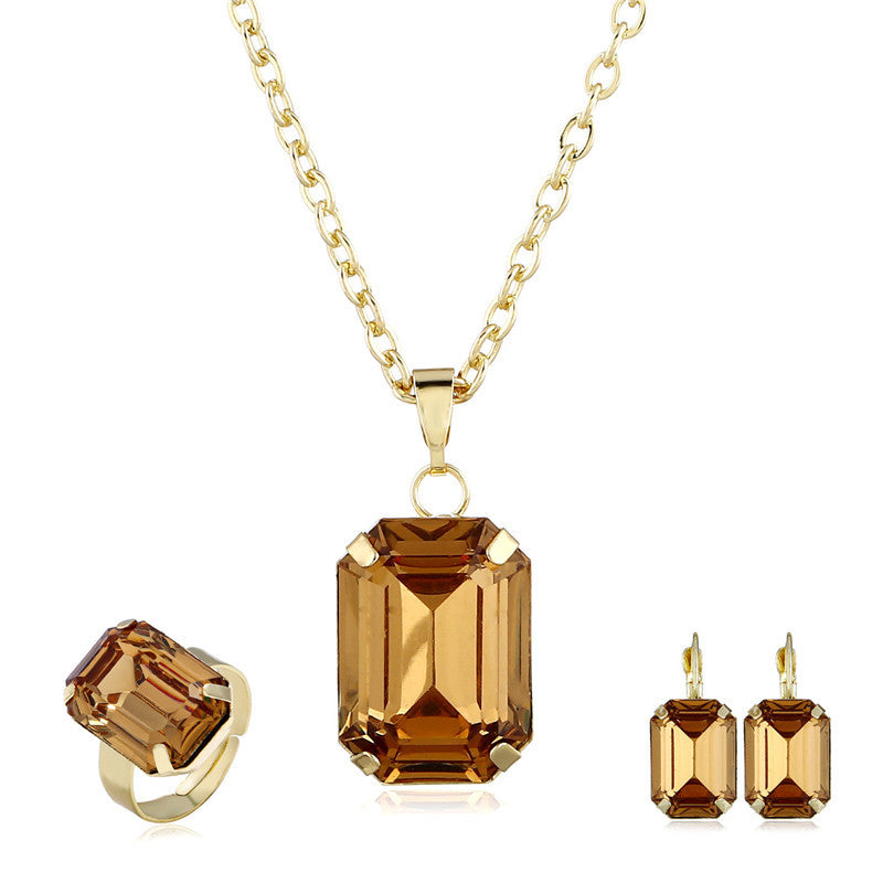 Bridal jewelry set with cognac stones; gold-tone necklace pendant, ring, and matching earrings (4-piece)
