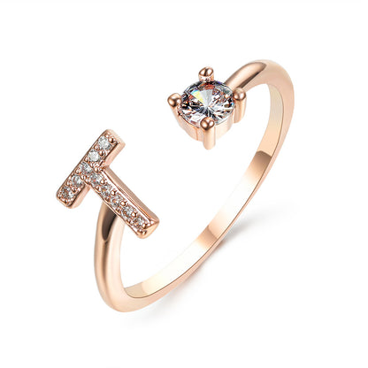Rose gold adjustable initial T ring with pavé crystals and a round solitaire stone, edenista