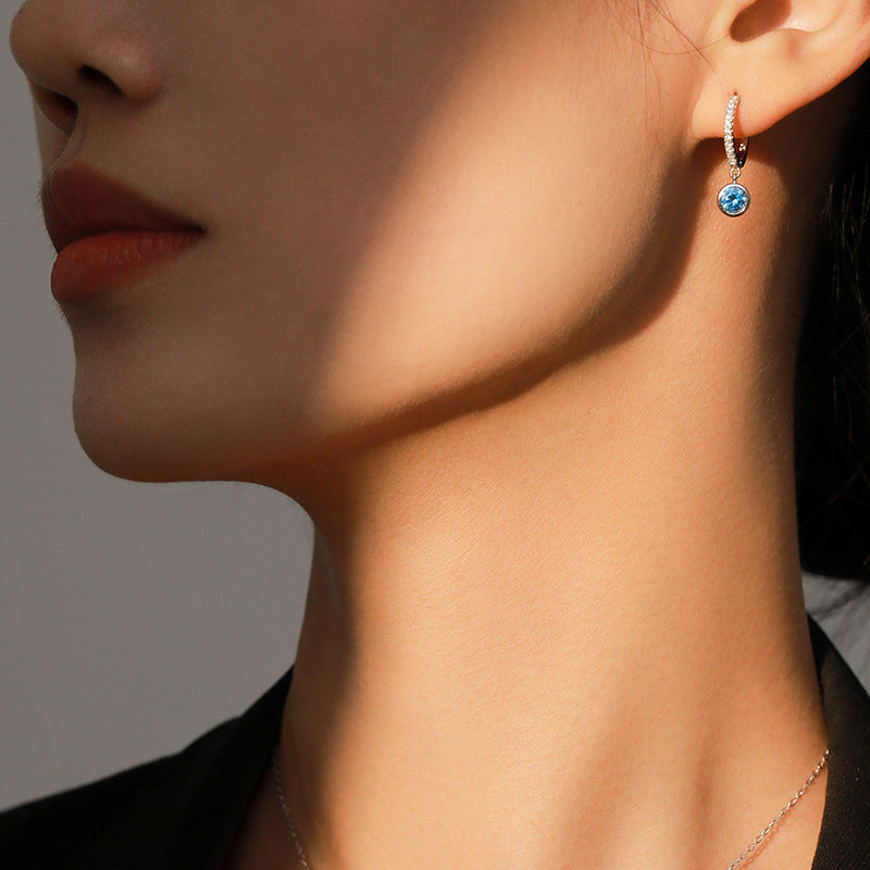 Women's sea blue artificial diamond hoop earring with a dangling blue gemstone, silver-tone