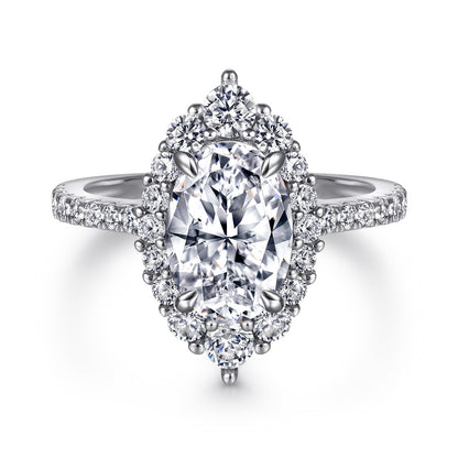 Oval-cut gemstone halo ring with pave diamonds on a silver band