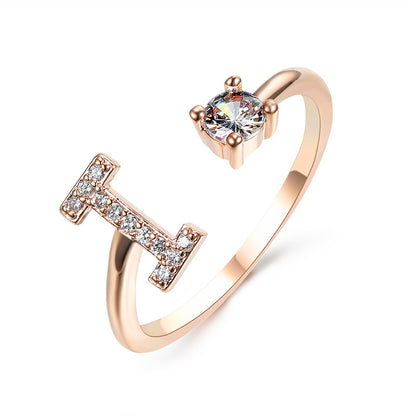 New design initial letter ring by edenista in rose gold, adjustable with pavé diamonds and a solitaire stone