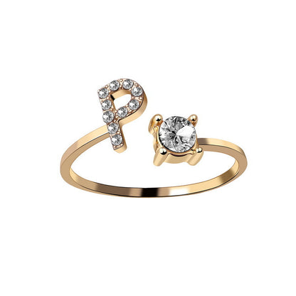 Ring by edenista in gold-tone, adjustable initial P with a diamond-studded letter and a solitaire stone