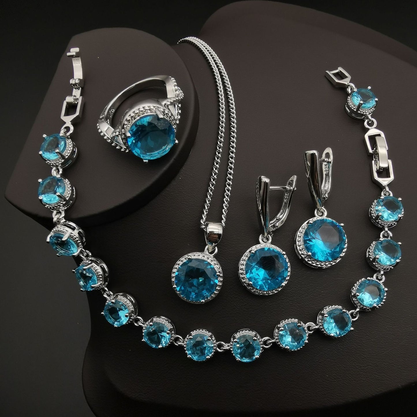 4-piece European and American style jewelry set with blue crystals in silver-tone metal.