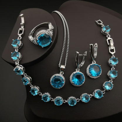 4-piece European and American style jewelry set with blue crystals in silver-tone metal.