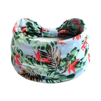 Bohemian Cashew Yoga Sports Headband in light blue tropical print with green leaves; cj brand