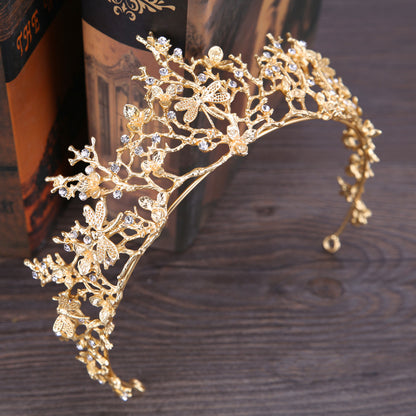 Gold-tone bridal headband crown with delicate floral filigree and crystal accents.