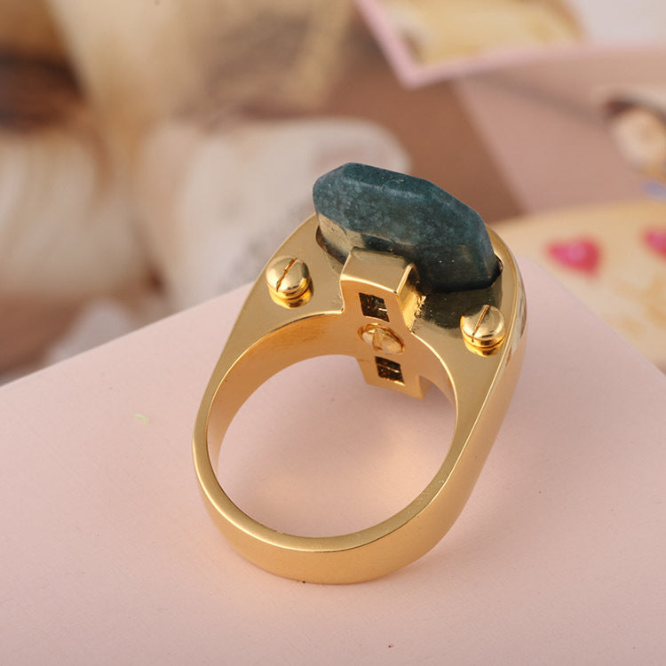 Gold-tone ring with a rectangular blue-green natural stone centerpiece