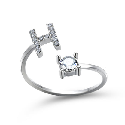 Initial letter H adjustable silver ring with pavé diamonds and a solitaire stone