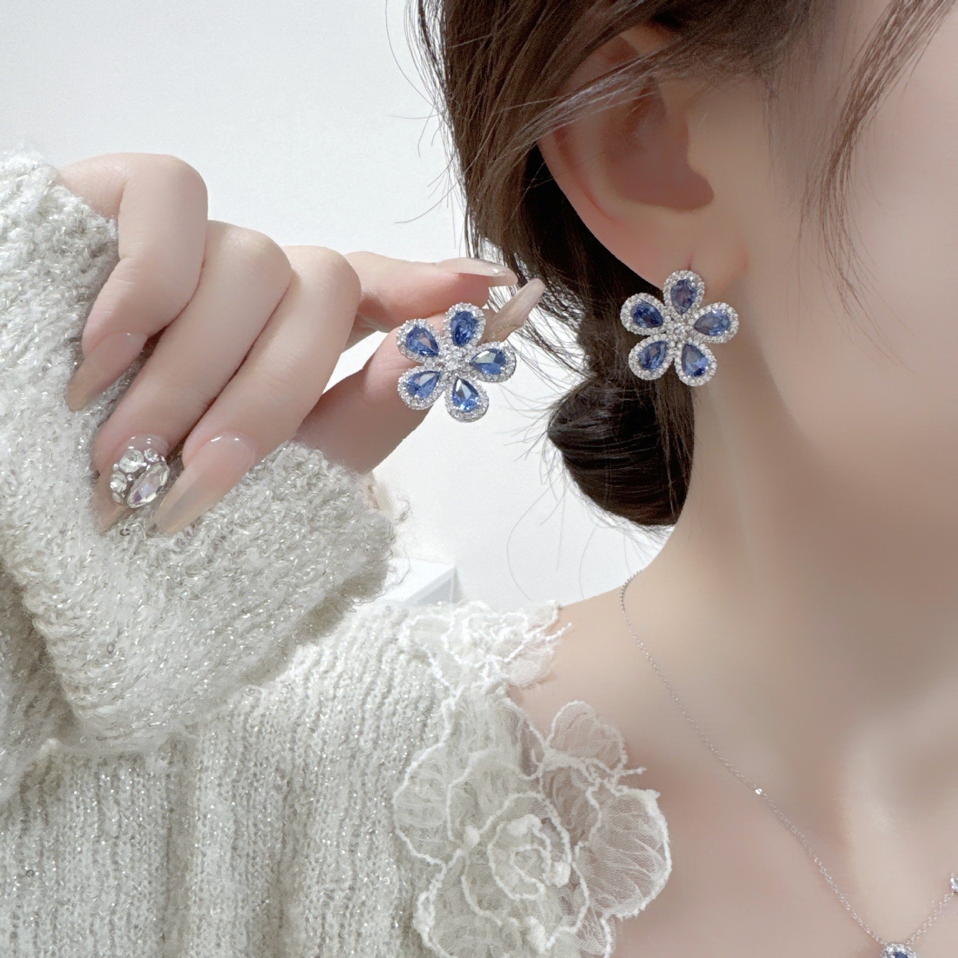 Sunflower blue zircon ear studs and matching necklace in a jewelry set
