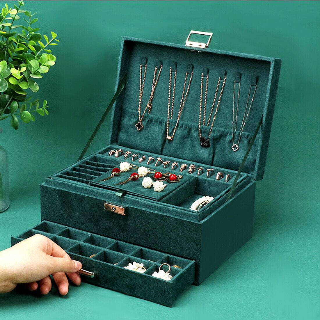 3-layer jewelry box organizer in green velvet with hanging necklace slots and a pull-out ring tray