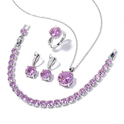 Geometric round jewelry set: necklace, bracelet, ring, and a pair of purple-stone earrings in silver-tone metal.
