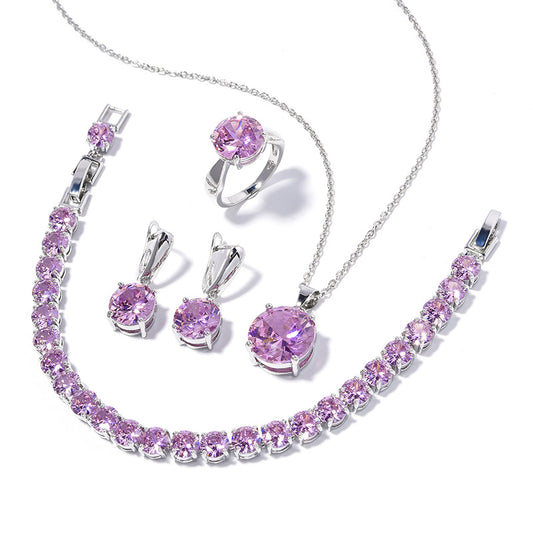 Geometric round jewelry set: necklace, bracelet, ring, and a pair of purple-stone earrings in silver-tone metal.