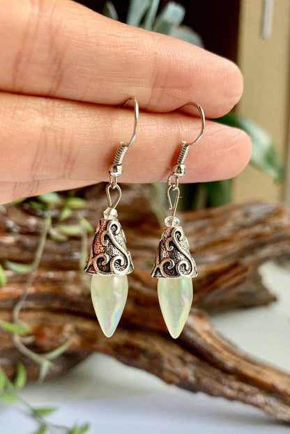 Color Crystal Diamond Earrings, a pair with opalescent teardrop drops and silver filigree caps