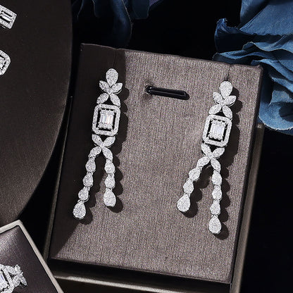 Zircon jewelry set of four: necklace, earrings, bracelet, ring in silver-tone with cubic zirconia