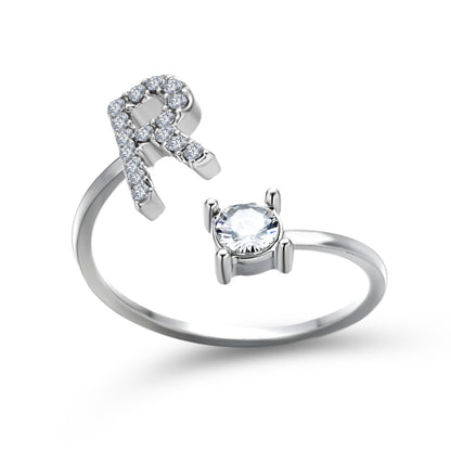 Ring set of two silver-tone rings: pavé-diamond initial-letter band and a solitaire gem band.